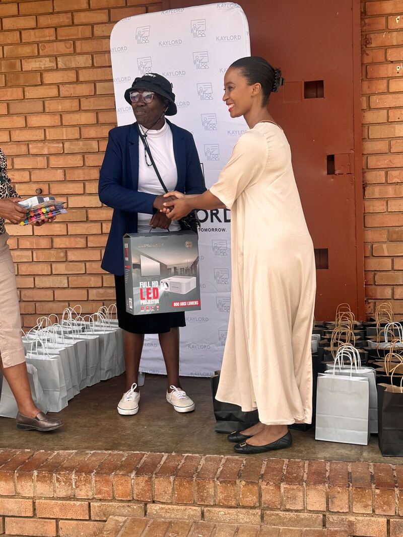 A Kaylord representative handing over equipment to a learner at a Kaylord-branded handover ceremony in Limpopo.
